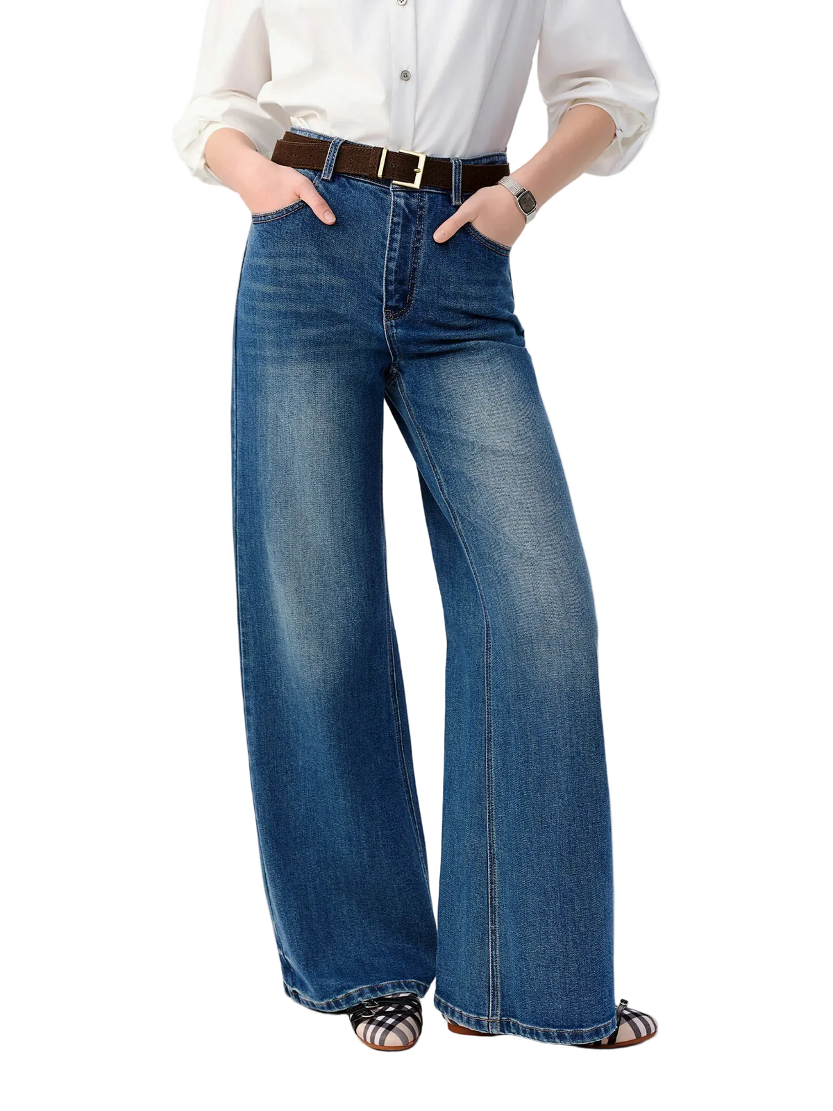 A model wearing blue wide-leg denim jeans with a brown belt, styled with a white button-down shirt and black sandals. The brand name 'Dushu' is visible in the top-left corner on a clean white background.